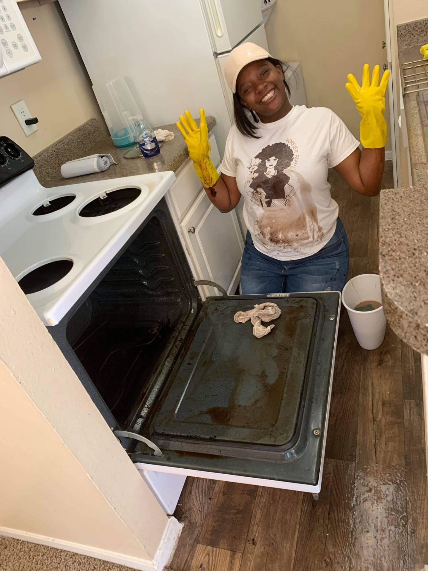 Forever Family cleaner smiling after a full oven deep clean