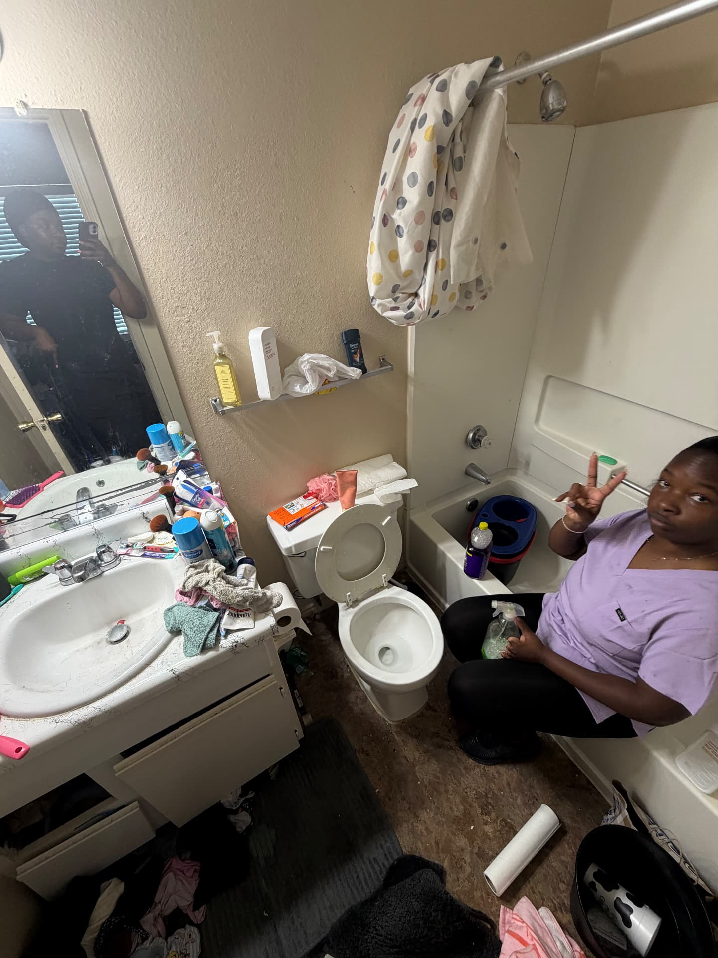 Forever Family cleaner starting an apartment bathroom deep clean
