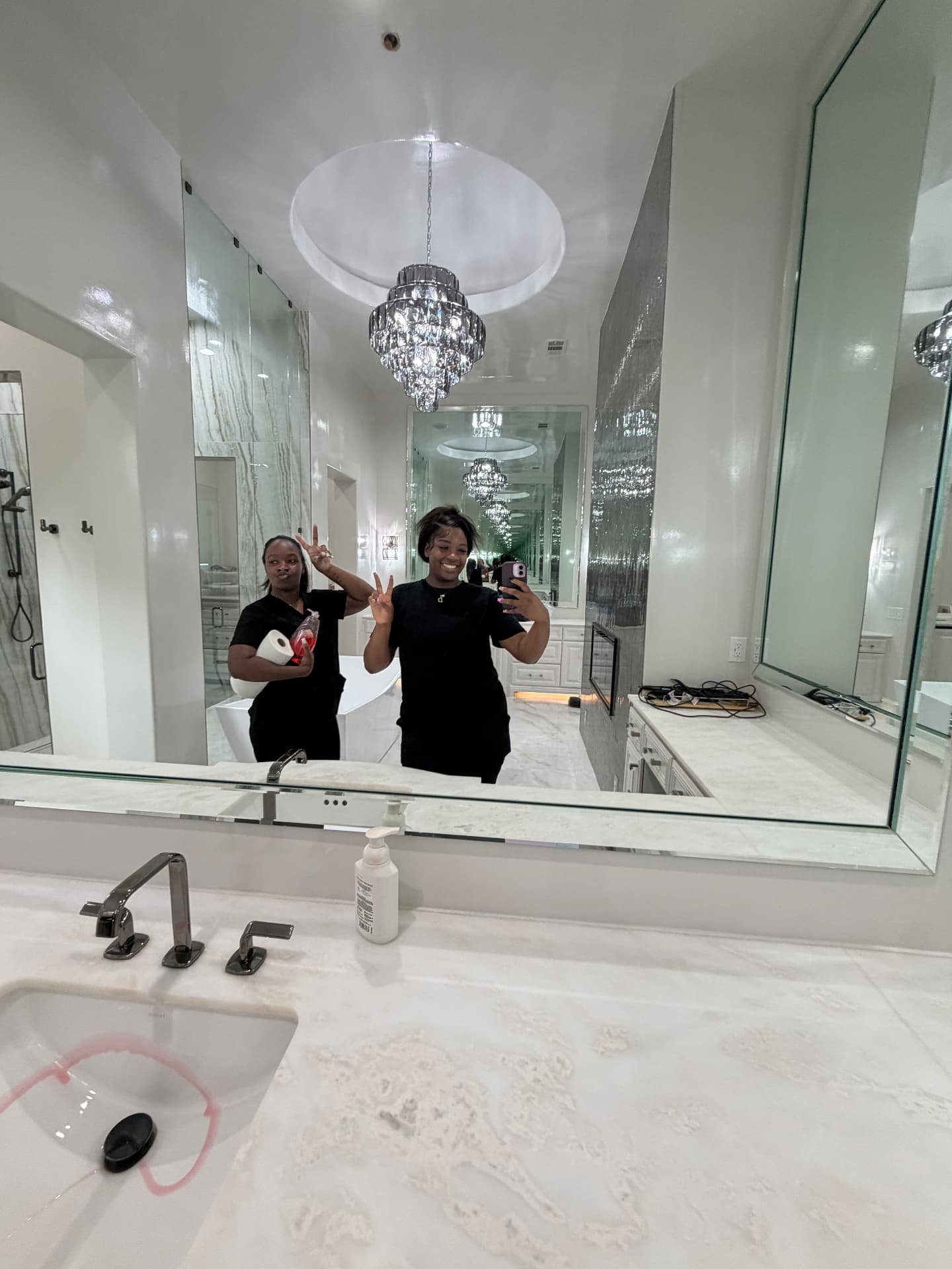 Forever Family team members in a freshly cleaned luxury master bathroom